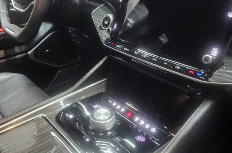 Interior view of a modern car dashboard featuring a sleek control panel and touchscreen display, highlighting high-quality detailing and design, relevant to Mr. Shine's car wash services in Pickering.